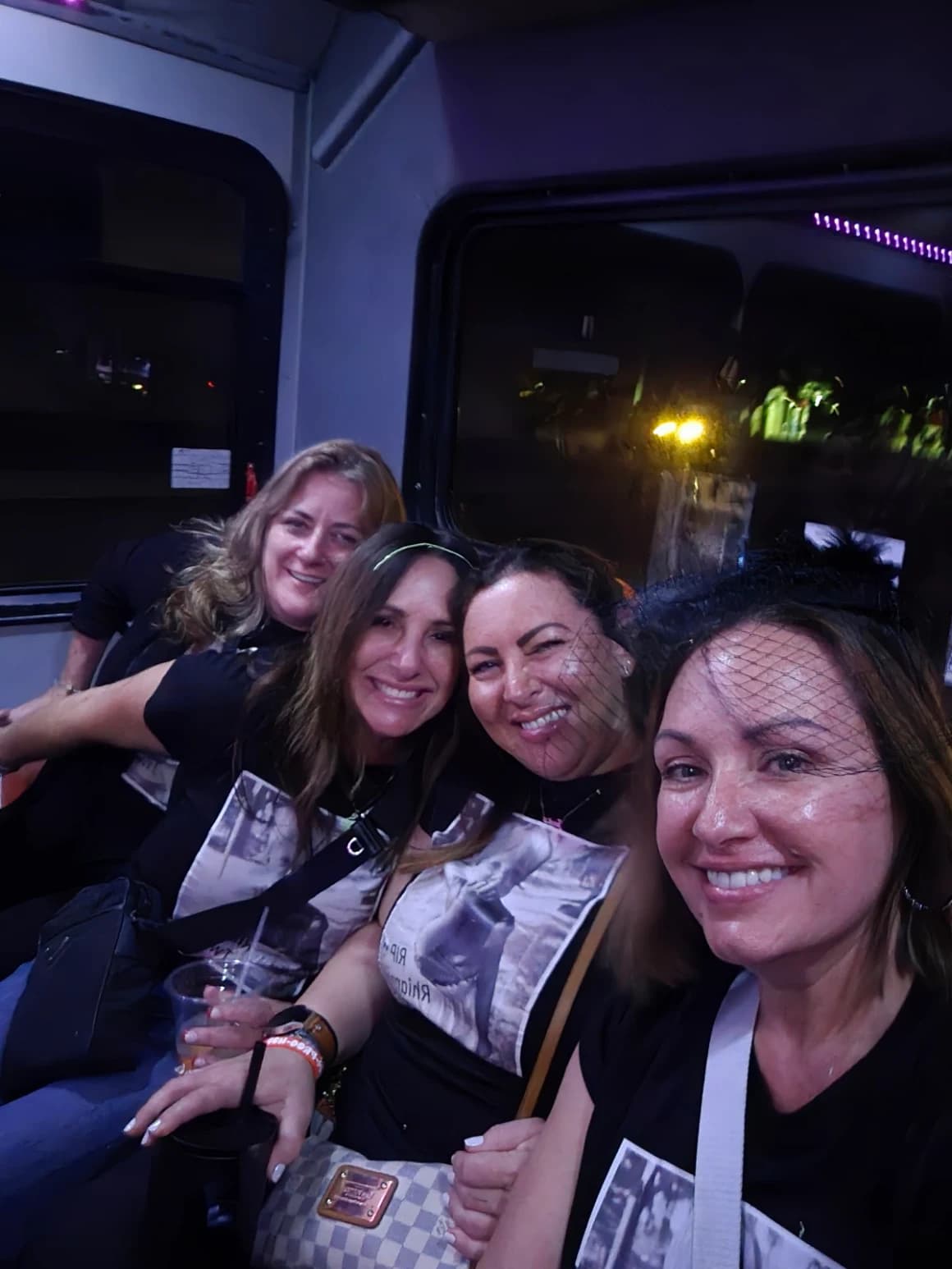 Four friends smiling for a selfie inside the Frog Hop