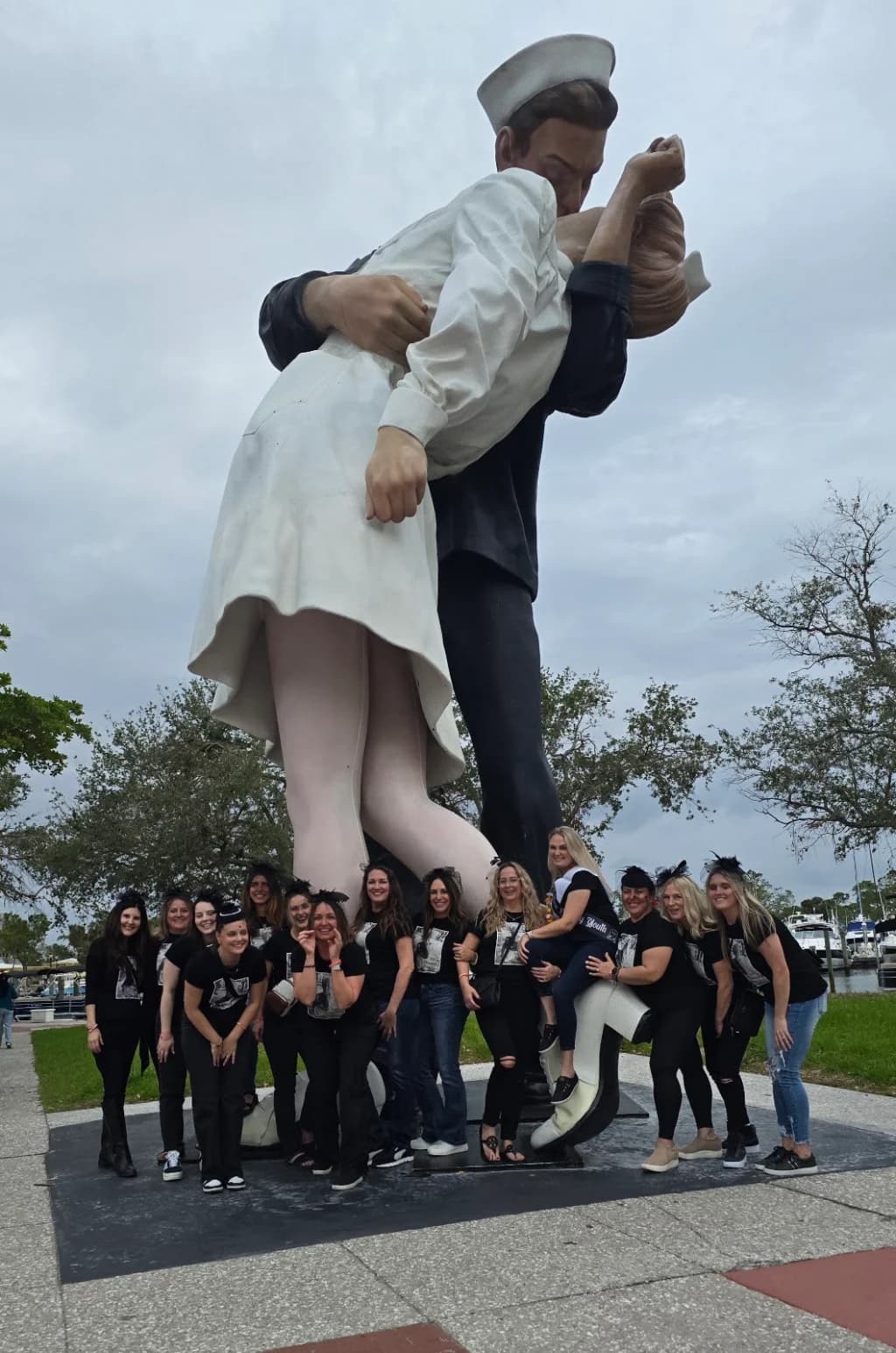 A Frog Hop group posing at the Unconditional Surrender statue in Sarasota